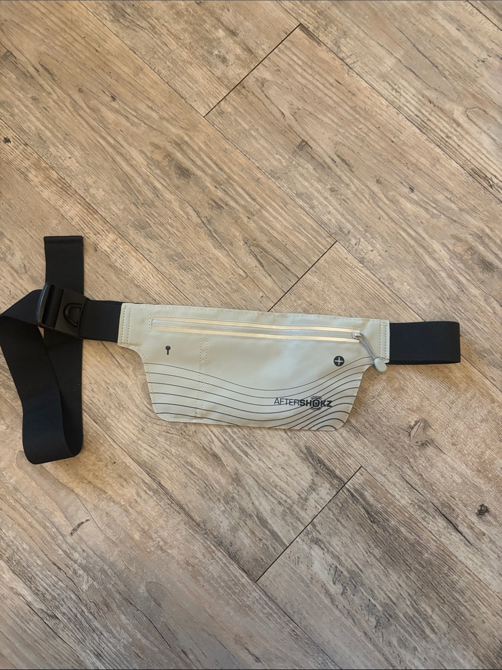 Aftershokz Light Gray Reflective Waist Bag with Black Strap